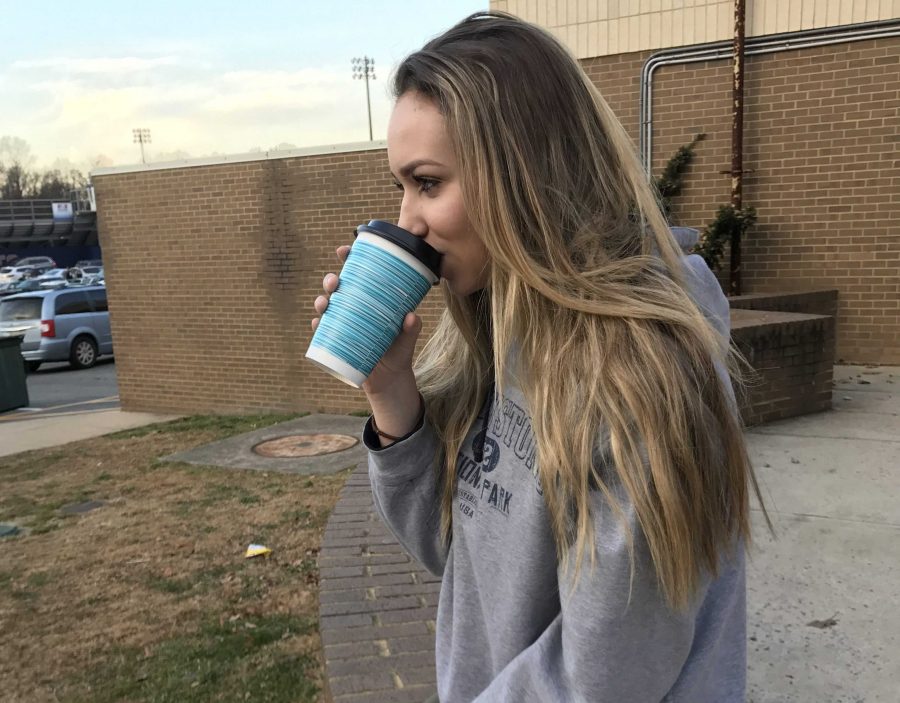 Hannah Shapiro-sophomore Julia Pucci drinking hot chocolate on chilly morningIMG_9575 (1)
