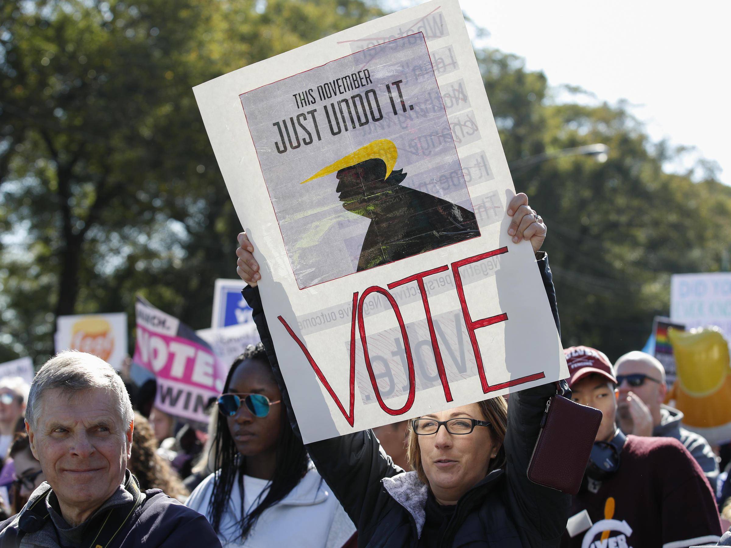 Women gather for a rally and march at Grant Park on Saturday in Chicago to urge voter turnout ahead of the midterm elections.