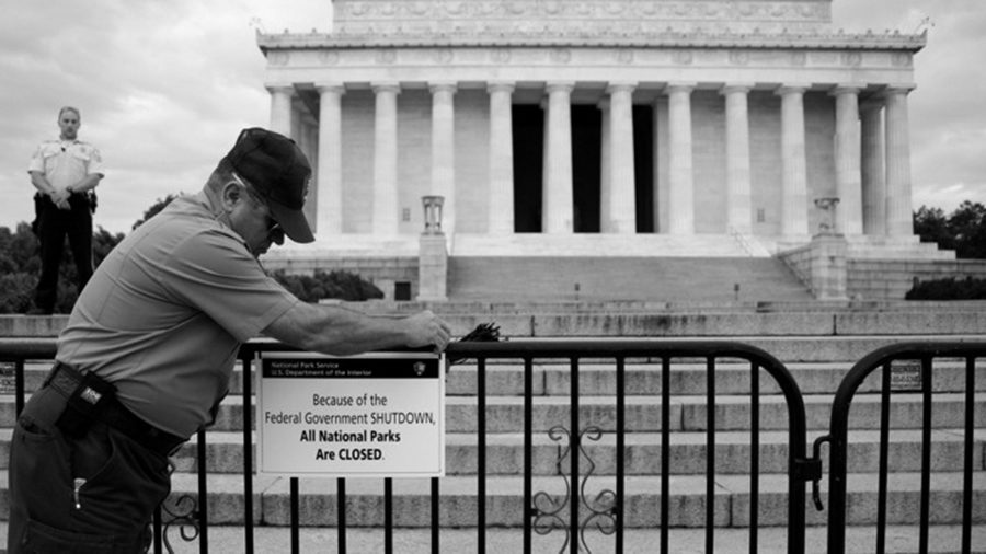 FILE - In this Oct. 1, 2013, file photo, A U.S. Park Police officer watches at left as a National Park Service employee posts a sign on a barricade closing access to the Lincoln Memorial in Washington. The world wont end if a dysfunctional Washington cant find a way to pass a funding bill before this weekend. That’s the truth about a government shutdown. The government doesnt shut down. It’s a crummy way to run a government, sure, but Social Security checks will still go out. Troops will remain at their posts. Doctors and hospitals will get their Medicare and Medicaid reimbursements. In fact, virtually every essential government agency, like the FBI, the Border Patrol and the Coast Guard, will remain open. Transportation Security Administration officers will continue to man airport checkpoints.(AP Photo/Carolyn Kaster, File)