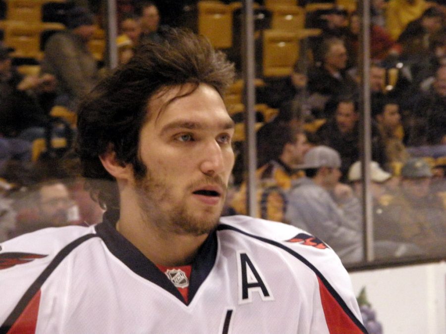 Professional ice hockey winger Alex Ovechkin skating during an ice hockey match.