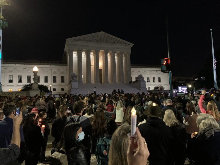 A large crowd gathers in front of the Supreme Court the night of Sep. 19 for a candle-lit vigil in honor of the late Justice Ruth Bader Ginsburg.