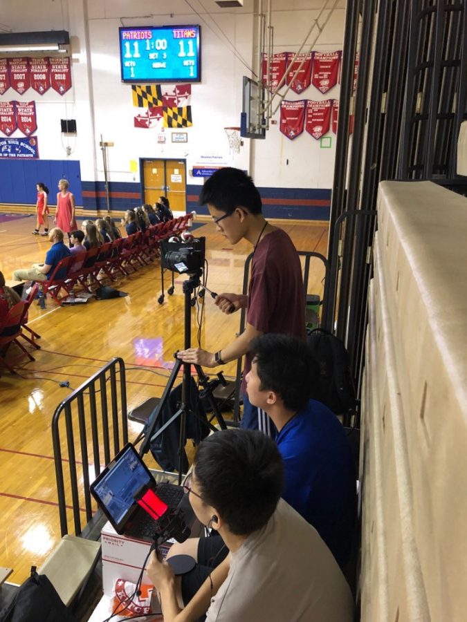 Seniors Raymond Yu, Eric Yeh and Philip Zhao broadcast a basketball game for Wootton Sports Network Club last year.