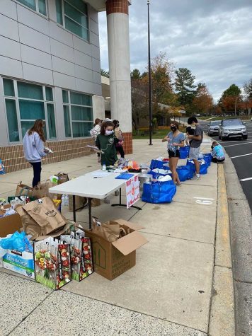 Wootton Families4Families Club packages food and supplies at their first drop off on Oct. 24.