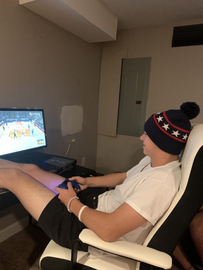 Sophomore Josh Erd plays video games on Oct. 29 after school. Erd enjoys playing video games because it gives him a break from school work.