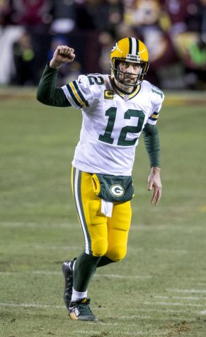 Aaron Rodgers celebrates after scoring touchdown on Jan. 16