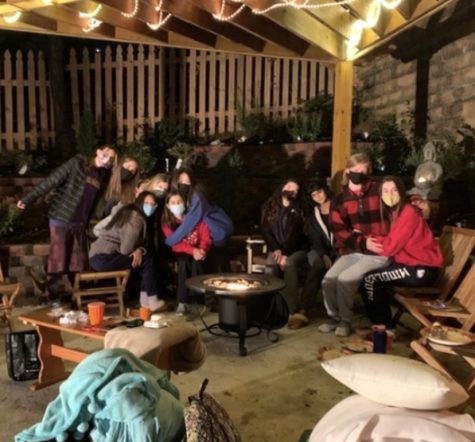 A group of Wootton juniors spend time together outside with masks on to prevent the spread of Covid.