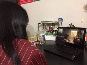 Senior Valerie Zhao watches the pilot of Fate: The Winx Saga.