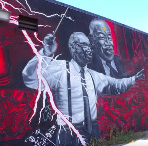 A mural located at the William Grant Still Art Center of Los Angeles, depicts William Grant Still electrifyingly conducting an orchestral score.