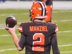 Johnny Manziel warms up before the game during his time in the NFL.