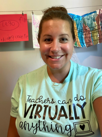 Social studies teacher Christina Rice smiles at her virtual teaching set up in her home on the first day of the current school year.