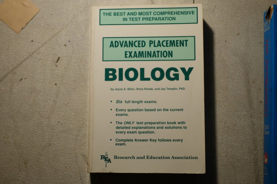 An AP Biology book like the one that would be used to study for the AP exam awaits reading.