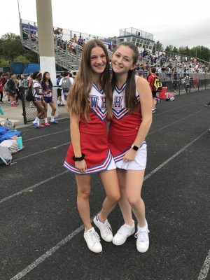 Seniors Quinn Lugenbeel and Jamie Stern switch field hockey uniforms with cheer for a pep rally in October 2018.