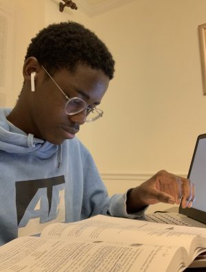 Junior Aidan Caesar studies for his AP Chemistry test.