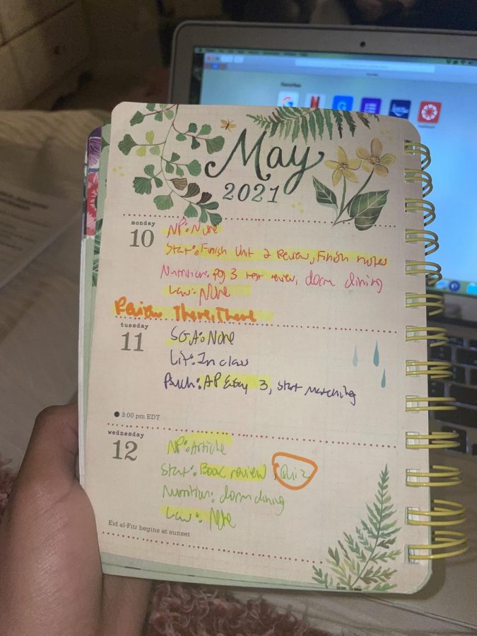 Senior Betty Berhane uses her planner to keep track of her assignments for the week