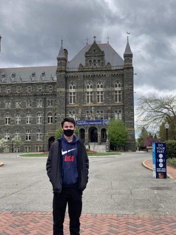 Senior Jeremy Ullman stands outside of the Georgetown campus entrance in a visit during February 2021.