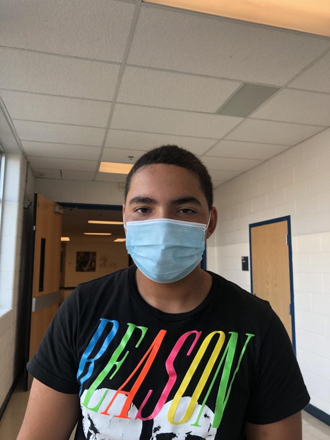 Among the new additions to the return to school are mask mandates, including for junior Luis Falcon. Masks are required inside school buildings (except for lunch), though they are optional in outdoor settings.