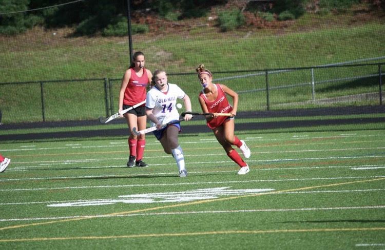 Sophomore Naomi Esterowitz  runs past the defender in a scrimmage against Old Mill.