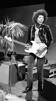 Jimi Hendrix plays his white Fender Stratocaster during a live show on television in 1967.
