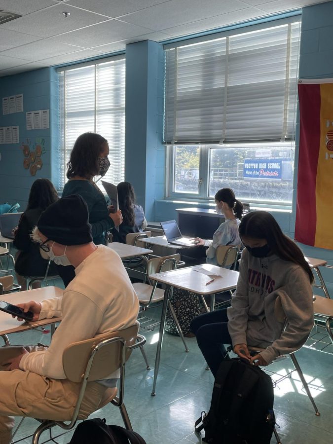 Spanish teacher Tamara Hounshell helps a student to review an assignment in her classroom.