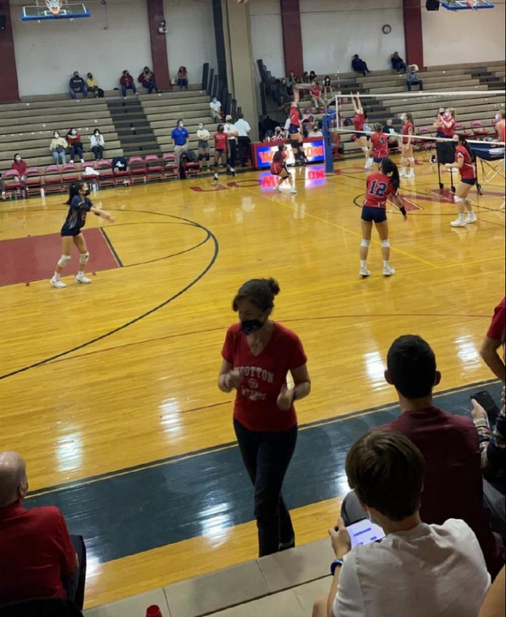 The volleyball team warms up ahead of the quarterfinals match.
