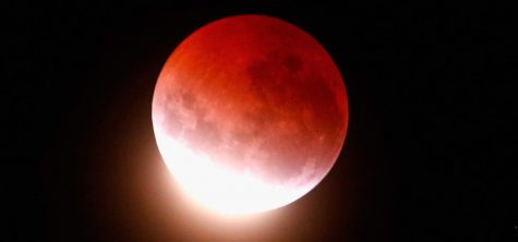 The reddish color of a Blood Moon is caused by the reflection of sunlight that has first passed through the Earths atmosphere.