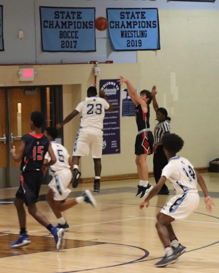 Senior point guard Ian Smith takes a shot in the corner against Springbrook.