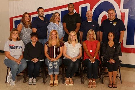 Counselor Robert Kurtz (top row, far right), pictured with the counseling department, said he uses what he learns as a club soccer coach to enhance his approach as a counselor.