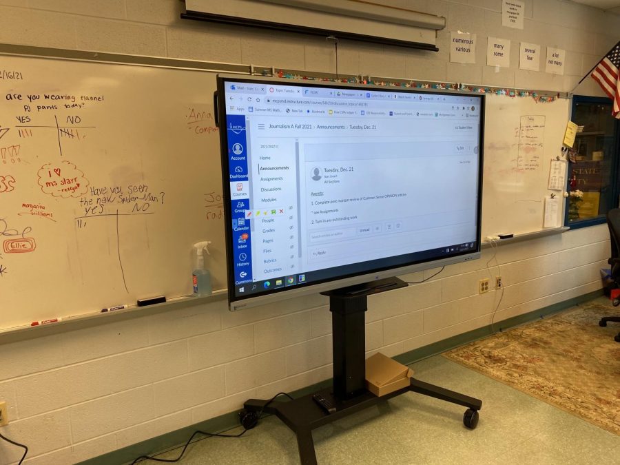 The Boxlight screen in teacher Evva Starrs room displays assignments for students reference. 