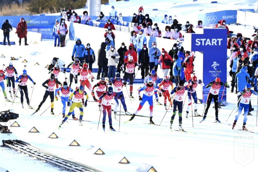 Racers+trek+along+in+a+biathlon+during+the+skiing+session+at+the+Beijing+Winter+Olympics.+Biathlons+consist+of+cross+country+skiing+and+rifle+shooting.+Norway+won+six+gold+medals+in+these+events.