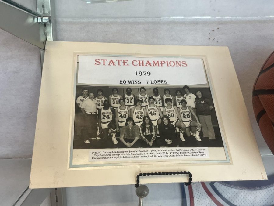A picture located in the trophy case celebrates the boys basketball team for winning the state championship in 1979.