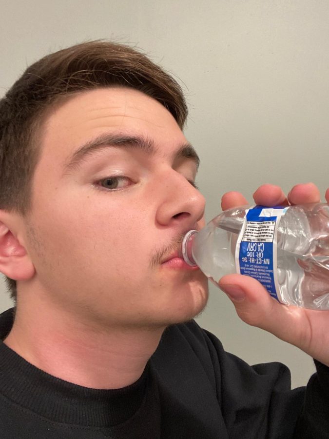 Senior Luke Jordan enjoys a refreshing bottle of Kirkland water.