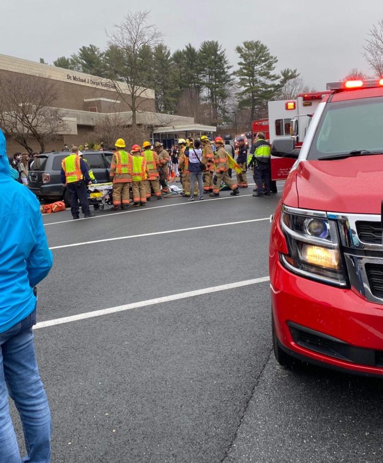 Students gather in front of school the afternoon of Mar. 17 to view a simulated drunk driving crash coordinated by the SGA. Working with the Montgomery County Fire Department and Every 15 Minutes program, the goal of the simulation was to raise awareness of the frequency and severity of distracted driving incidents.