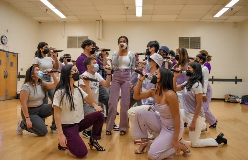 The Acatonics practice their final song, Sledgehammer, in full costume. The group met after school on Feb.  17 to run through their set. “Even though its sometimes stressful, its honestly such a fun experience being able to bond with your teammates,” senior Roshni Arun said.