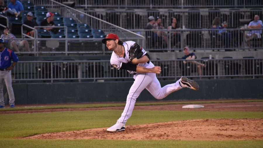 Minor League baseball player Aiden Mcintyre pitches during a game.