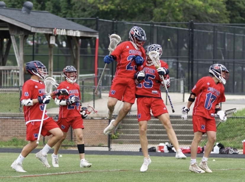 Junior Ryan McGraw celebrates with teammates after scoring a goal in the 2021 season.