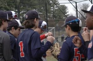 The JV team huddles after their victory against Paint Branch on Mar. 21.