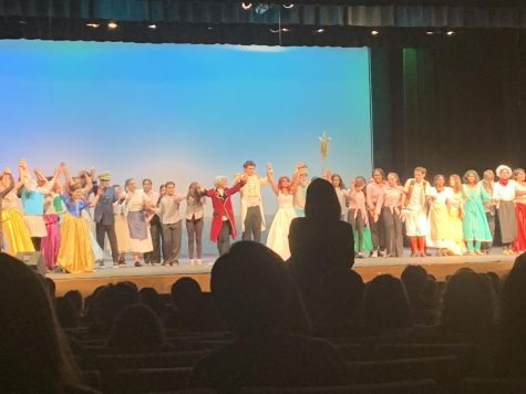 The cast of The Little Mermaid takes their bow after a performance.
