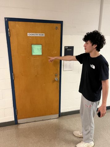 Junior Harel Sabag points at one of the many doors throughout Wootton.