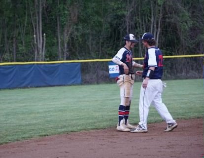 Junior Josh Erd and senior AJ Grainger hug it out on senior night.