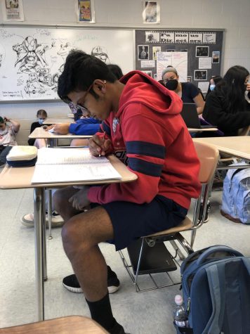 Junior Souvik Kar practices for his AP AB Calculus exam at the beginning of class on Apr. 29.