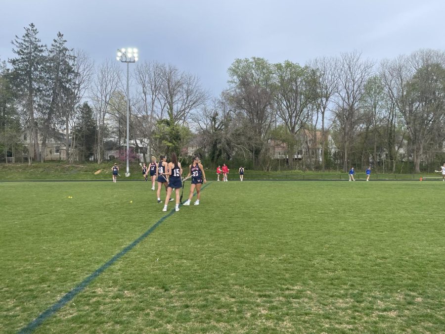 Girls+varsity+lacrosse+warms+up+for+their+game+against+Sherwood.