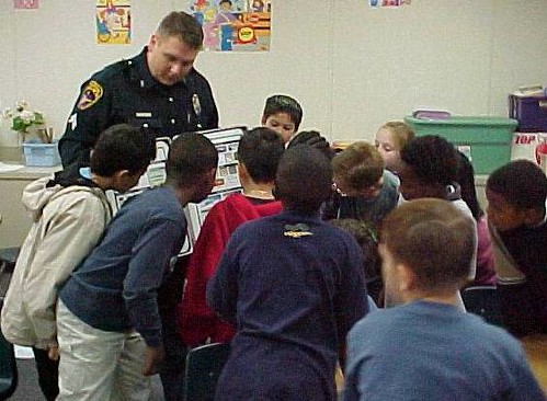 A School Resource Officer bonds with students at his assigned elementary school.