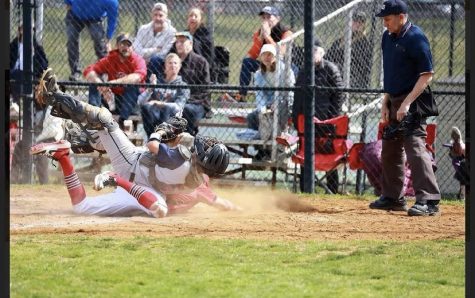 Sophomore catcher Lucas Sosa gets into a collision at the plate against Quince Orchard on Apr. 23.