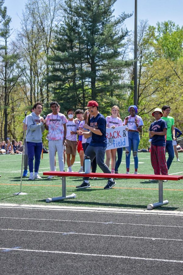 The track and field team receives applause as one of several spring sports featured at the spring pep rally.
Senior Elvin Mun flipped to entertain the students.