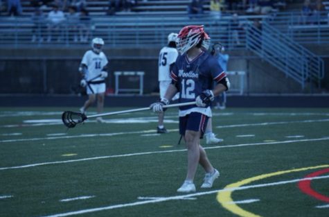 Senior defenseman Nate Jacobs analyzes the field in the game against Richard Montgomery on Apr. 1.
