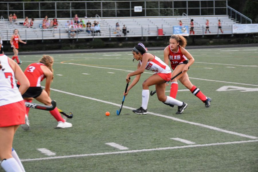 Junior Rhea Chelar passes the ball to a teammate during the game against Blair on Sept. 14.