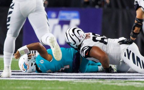 Miami Dolphins quarterback Tua Tagovailoa get sacked in a game against the Cincinnati Bengals, resulting in a severe concussion.