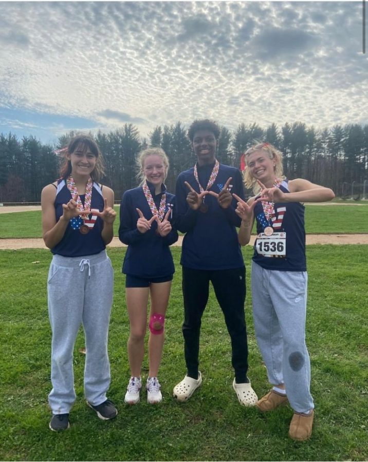 Senior Rebecca Vasconez, junior Victoria Ketzler, junior Troy Bailey, and senior Maya Gottesman celebrate placing in the top 25 for the 2022 4A West High School Cross Country State Championships on Saturday, Nov. 12.