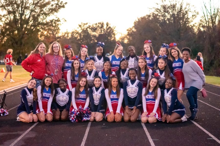 Varsity+cheerleading+joins+forces+with+the+Magruder+cheerleading+team+before+round+one+of+the+4A%2F3A+playoffs.