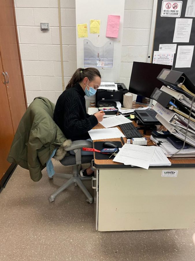 Math teacher Jonida Kocani grades quizzes during her off period.